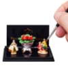 Picture of Fireplace Decoration Flower Bouquet with two fireplace figures