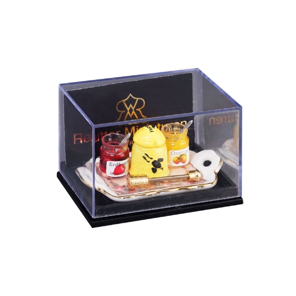 Bild von Honigfrühstück mit goldenem Honiglöffel